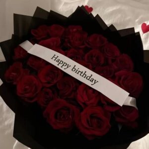 luxury red rose birthday bouquet with black wrapping and happy birthday tag gift in Lahore